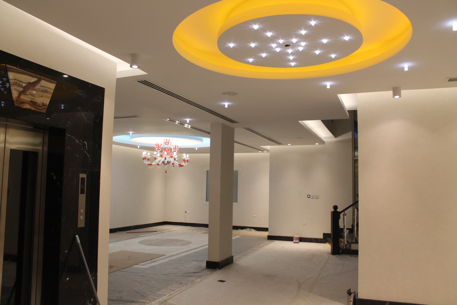 Villa lobby with feature ceiling and lift lobby