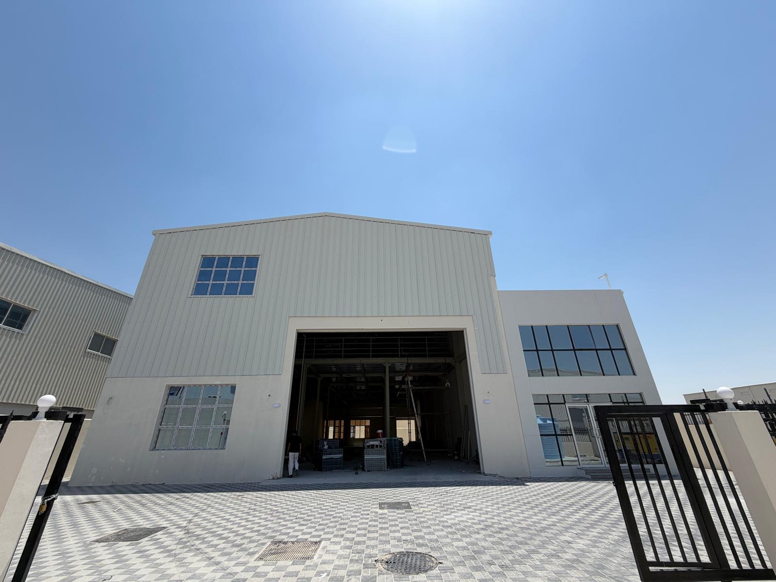 Completed warehouse with adjoining office block at Birkat Al Awamer